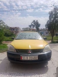 سيارة لانسر تكسي موديل ٢٠١٠ رقم بغداد سنوية لغاية ٢٠٢٩ السعر ٦٨ ورقة و...