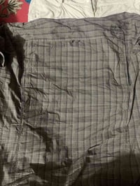 بنطرون ٣٤ • قميص جاك ولفسكن اكس إل • حقيبة كولمبيا