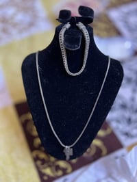 زنجيل ٢٣غ • سوار ٣٣غ • سيف الإمام علي