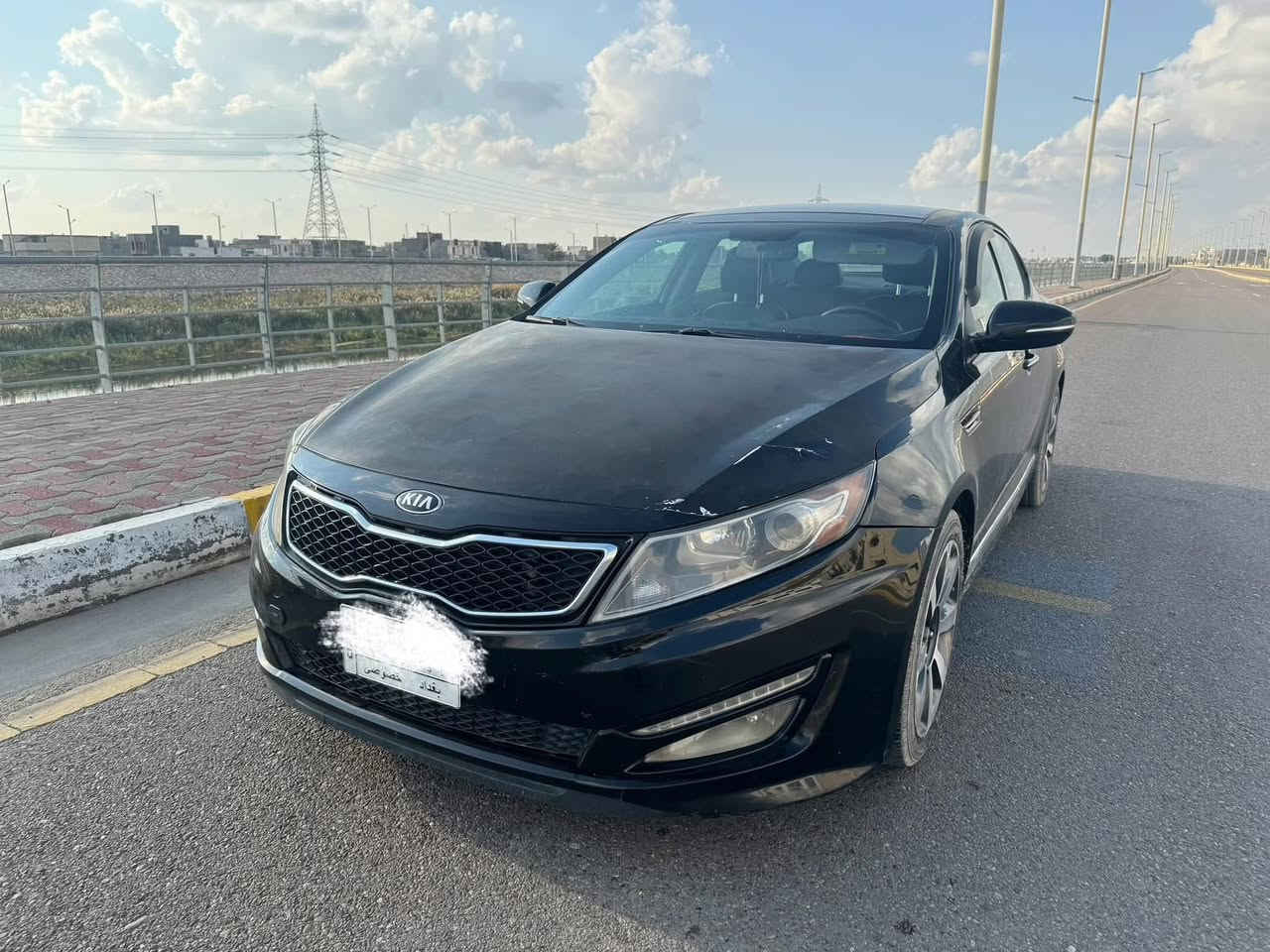 السلام عليكم
اوبتيما 2013 فول 1/1
وارد امريكي ضربتها بس بنيد بدون دواخل حتى المازده مالتها الاصلية مبدلين جاماتها بس ومثل ما موجود بالصورة السيارة نظيفه والباب والجاملغ الخلفي فقط شخط بدون ماصبغته ضربه بسيطه مثل ماموجود بالصور 
1. صدرها امامي وسط خلفي جديد
2. تايرات امامي خلفي جديد
3. محرك 2000 تيربو بلادي نظيف وگير نظيف وضعيتين 6 سرعات شفتات بالستيرن 
4. كشنات جلد فول كهربائي خزن وضعيتين للسايق وامامي تدفئة وتبريد كشنات خلفي تدفئة .
5. دخول بصمه للأبواب الامامي 
6. ⁠ السقف بانوراما 
7. ⁠تحكم كامل بالستيرن
8. ⁠شاشه الحجم الكبير بلادي 
9. تدفئه تبريد فول 
10. ⁠ويل كب حجم 18 حساس داخلي اصلي 
11. ⁠لايت زنون بلادي 
السياره ماشيه 105 الف ميل 
رقمها بغداد /م ومشروع وطني باسمي وسنويه 2026 والتحويل ثاني يوم السياره بالرمادي 
السعر 11،000 دولار(110 ورقه)
رجاءاً بس شراي يتواصل متواجد على الفيس ***********
