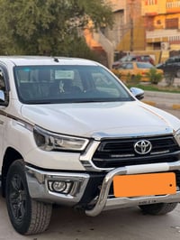 تيوتا هايلوكس كويتي موديل  2024 رقم بغداد انكليزي  ماشيه 58 الف كفاله ...