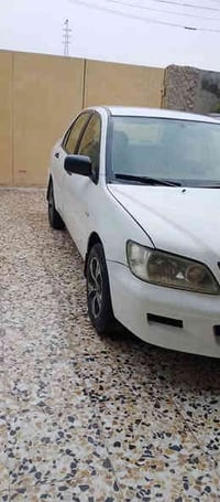 لانسر 2002 رقم بغداد مجدده ل30 السياره نضيفه وحلوه بلاديه السونار مراف...