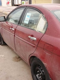 سيارة اكسنت موديل 2008 أمريكي  للبيع خصوصي لون ماروني بغداد   بيها ضرر...