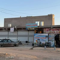 محلات للبيع عنوان حي بدر شارع مول حسين  مساحه ١٠٠م ركن  ٦محلات  +درج و...