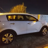 سبورتج مديل ٢٠١٤للون ابيض محرك ٢٠٠٠ رقم بغداد -انكليزي خليجي كفاله عام...