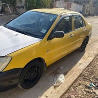 لانسر موديل 2006 وارد أمريكي بدون حادث جايه ع سعوديه بدون ضرر ليبل واح...