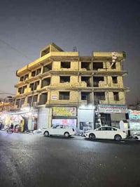 عمارة تجارية • النعيرية بغداد • ٨ محلات ١٨ شقق