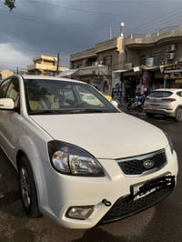 كيا ريو  موديل 2012 بدون صبغ ولا بارد  رقم اربيل الدولي سنويه وهزه جدي...