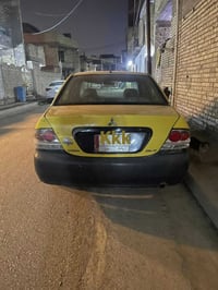 سياره للبيع لانسر الفين 11 رقم بغداد للاستفسار 07716817796