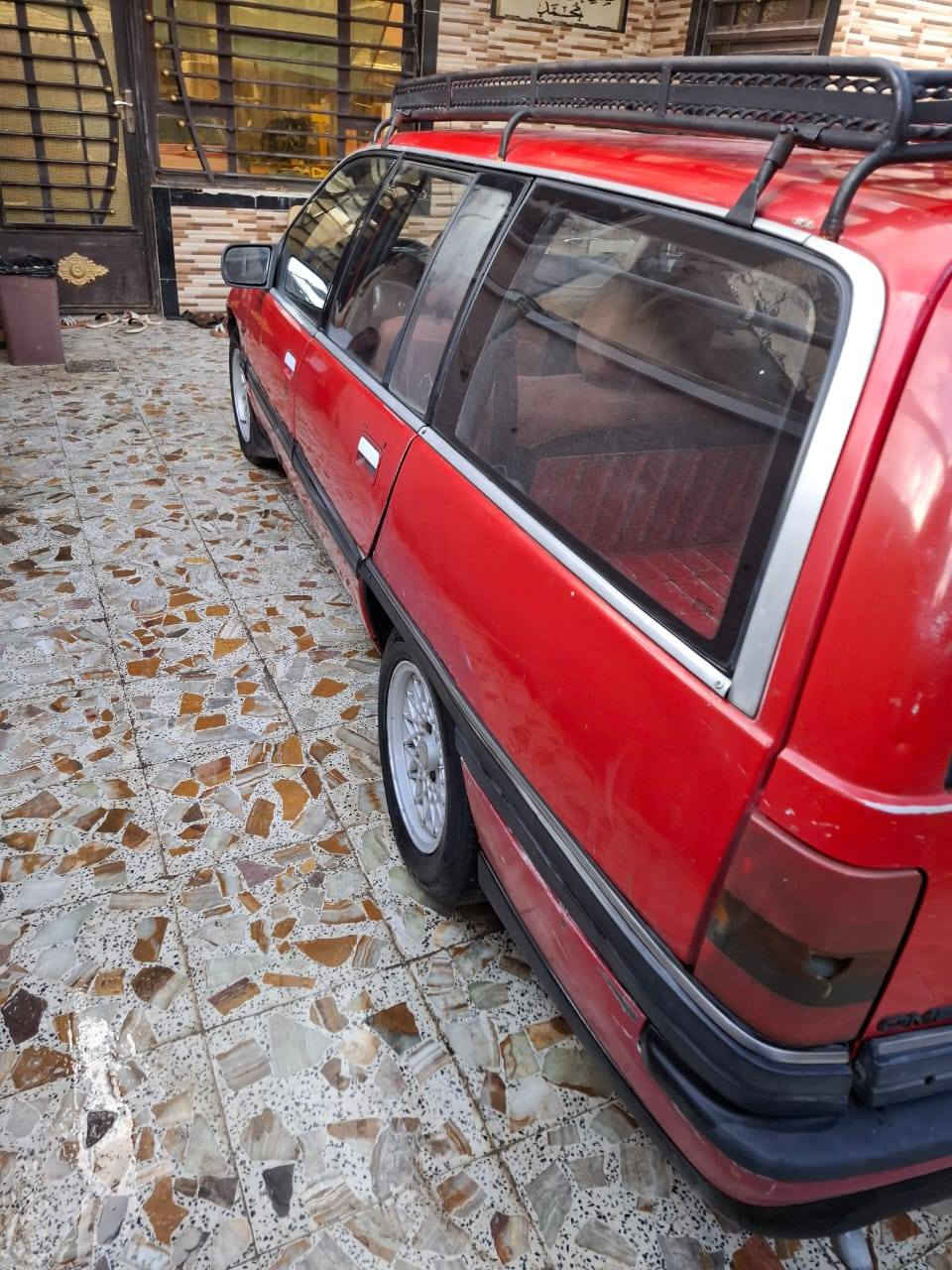 اوبل اوميكا ستيشن حمره 20  رقم انكليزي بغداد باسمي ***********
