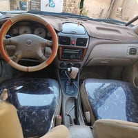 نيسان ياباني 2010رقم بغداد  محرك 1600كير مكينه مكفول صدر امامي خلفي مم...