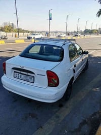 بسم الله الرحمن الرحيم دايو لانوس 2001 مشروع وطني رقم انكليزي بغداد كي...