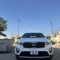 كيا سورنتو خليجي رقم بغداد الماني بسمي  لون ابيض  موديل ٢٠١٦  فووول مو...