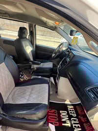 دوج كرفان ابيض رقم بغداد باسمي موديل 2014 حادثها باب الخلفي مع الجاملغ...