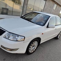 صني ٢٠١٠ • توماتيك • أبيض