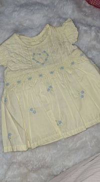 ملابس أطفال • ٦-١٢ شهر