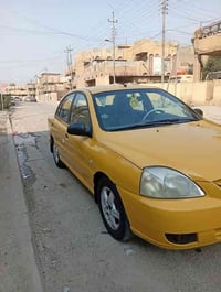 كيا ريو موديل 2010 شركه عامه اصلهه يعني اصفر مكينه وكير وصدر وتبريد ثل...