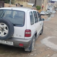 سبورتج ٢٠٠١ • بيضاء • رقم بغداد