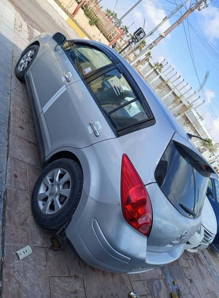 نیسان ڤێرسە ئەمریکی  مۆدیل 2009 گێر تۆماتک مەکینە20 تەبرید سارد و گەرم بەشەرت،  تەعدیل سورعە، سێ پارچەی پێشی سبوخە لەگەل نیو سندوق بەدەنەی پێشی گۆرایە ، تەقە و رەقە بەشەرت بەناو کردن بەشەرت، 70هەزار غرامەی لەسەرە ، هەزە نوێیە ،سۆیلی گێری تازە گۆرایە و رون و فلتەر تازە گۆرایە ، سەنەوی سێ چار مانگی مایە، مەکینەی کەمێک سەرفی هەیە،  سعری 88 و مەجالەکە برایانە
*********** أربيل, العراق
