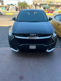 كيا سبورتج 23 حجم لارج محرك 2000  حادثها جاملغ خلفي يسره وتبديل باب خل...
