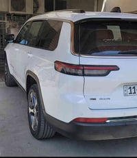 جيب كراند شيروكي ابيض  لمتدد رقم بغداد انكليزي بأسمي موديل 2023 وارد ا...