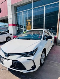 كورلا 2024 رقم بغداد  بصمه  بدون فتحه رادار امامي عداد المشي 25,000km ...