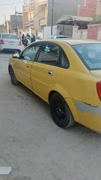 اوبتره 2004 اوتو ماتيك رقم بغداد تخم تاير جديد مصفره هيه وغرامه السيار...