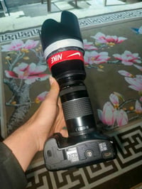 كانون D7 • عدسة 75-300 • شاحن وبطارية