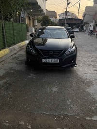 نيسان التما موديل 2018 SL  فول عدا الفتحه ضرر السياره يونيد + جاملغ فق...