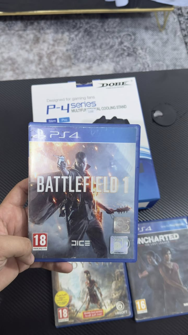 السلام عليكم شباب، متوفر عندي مجموعة ألعاب بلايستيشن 4 (PS4) أصلية ونظيفة جداً وبحالة ممتازة (شغالين 100%)، بالإضافة إلى قاعدة تبريد وشحن للملحقات.

🎮 قائمة الألعاب المتوفرة (سعر القرص الواحد: 15 ألف دينار):
1 Battlefield 1
2 Assassin's Creed Odyssey (نسخة تدعم اللغة العربية)
3 Uncharted: The Lost Legacy
4 Mortal Kombat XL

🔌 ملحق إضافي للبيع:
 قاعدة تبريد وشحن للمصنع DOBE (P-4 Series): متوافقة مع جهاز PS4 Slim و PS4 Pro. القاعدة ممتازة لتبريد الجهاز وشحن للجويستك استخدام يوم واحد فقط 

📍 تفاصيل إضافية:
 الموقع: [كربلاء ملحق الفارس]
 التوصيل: (ماعندي توصيل تجي للبيت تاخذهم) 
 للتواصل:واتساب ***********
