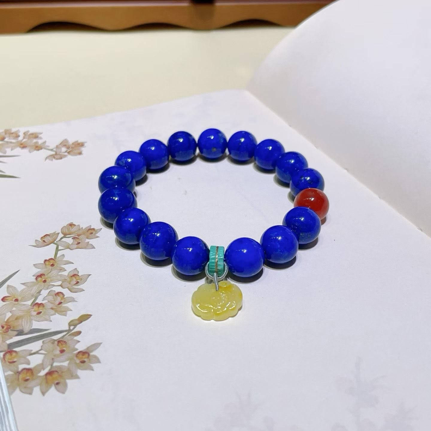 Natural Lapis Lazuli Bracelet

Fine jewelry is more than just an accessory; it serves as the switch that sets the tone for your mood each day.

Today, I’m sharing a "stunning tri-color" combination that is sure to captivate you at first glance:
🔹 Natural Lapis Lazuli: Pure blue with minimal white veining and sparse gold flecks, it resembles a starry midnight sky, exuding an innate aura of mystery and nobility. It acts as your anchor, helping you maintain your composure and stand out effortlessly amidst the crowd.

🔹 Nanhong Agate: That rich, deep "persimmon red" hue is reminiscent of the warm sunshine on a winter's day. It works wonders for brightening your complexion—for those with warmer skin tones, wearing it instantly makes your skin appear two shades fairer.

🔹 Amber: Possessing a soft, creamy-yellow texture, it feels like time itself has been crystallized. Serving as a transitional shade, it harmonizes the cool tones of the Lapis Lazuli with the vibrant intensity of the Nanhong Agate.

The interplay of blue, red, and yellow creates a fusion that captures both the romance of French aesthetics and a touch of vintage Chinese charm.

無論是通勤的襯衫，還是週末的一襲長裙，它都是手腕上最吸睛的存在。

If you would like this subtle beauty to become your daily companion, write to me 
📩WhatsApp：8613308361107

Don't wait, because a bracelet like this will probably never appear again


**إذا كنت صاحب هذا الإعلان وتريد حذفه لأي سبب، رجاءا أرسل رسالة إلى الدعم الفني**