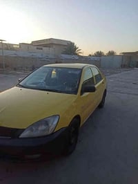 لانسر بومه موديل ٢٠١٠ بغداد مصفره هيئة وغرامات مكفوله من الضربه والصبغ...