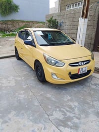 اكسنت مضلع جنط امريكي موديل 2015رقم بغداد اجنبي هيئا وغراما مصفرا محرك...