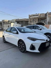 للبيع كورلا 2019 أمريكي SE لون ابيضّ رقم بغداد الصور الحادث مرفقة بالم...