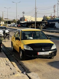 لانسر 2010 للبيع السياره كامله تبريد تدفئه خير من الله  مكفوله كفاله ع...