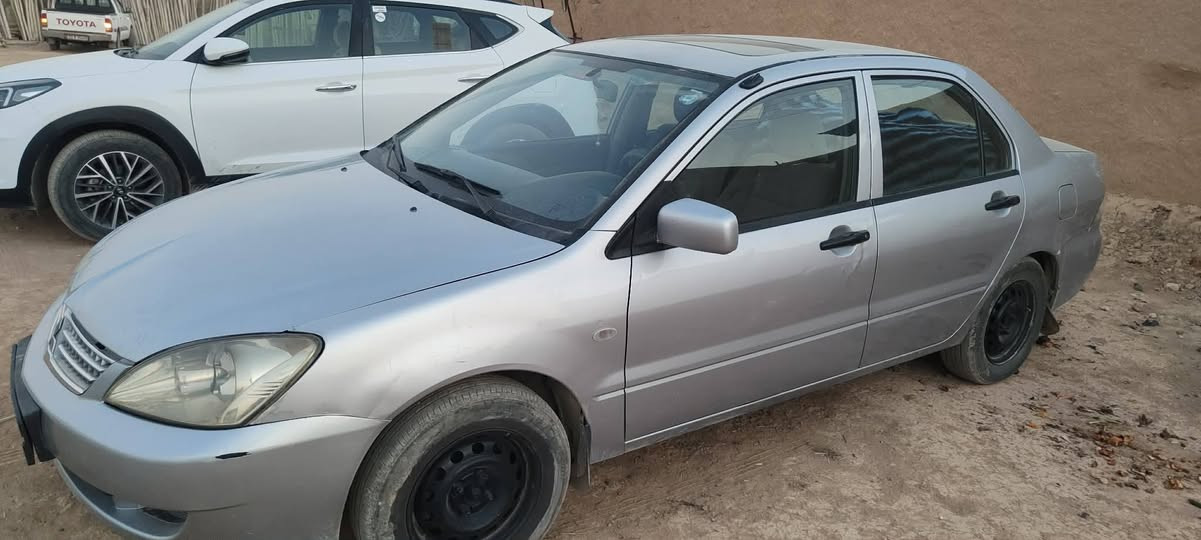 لانسر 2005 محرك 1300 رقم اربيل بيها قطعتين صبغ سعر 67 وبيها مجال مكان نينوئ رقم ***********
