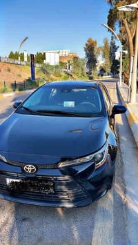 تويوتا كورولا 2024 للبيع  ماشية 12.000   بيها اربع قطع   رقم ديالى تحو...