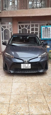 كورلا موديل ١٨ LE امريكي محرك ١٨٠٠ كير جديد  لون نفطي رقم بغداد الجديد...
