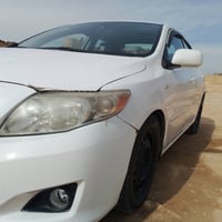 من رخصة الادمن كورلا موديل 2008 رقم انبار انكليزي  ضررها طخه بسيطه برا...