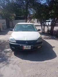 للبيع لانسر بومه ٢٠١٠ عادي مكينه ١٥٠٠ محرك وكير بحاله جيده بيهه هلالات...