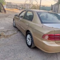 سياره كيا اوبتيما 2001صبغ عام جماليه تحويل مباشر غرامه مصفره وهزه جديد...
