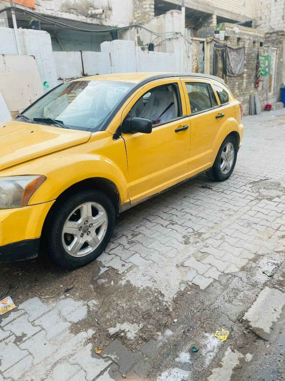 السلام عليكم دوج كاليبر مديل 2007 سياره نعمه من الله مكينه حلوه بس الكير بي مشكله مشكل على نمره وحده ولكشر كدامكم واضح بصور مصفره السياره تحويل ثاني يوم  سعرها 30 وبيها مجال عنوان بغداد مدينه الصدر استفسار ***********
