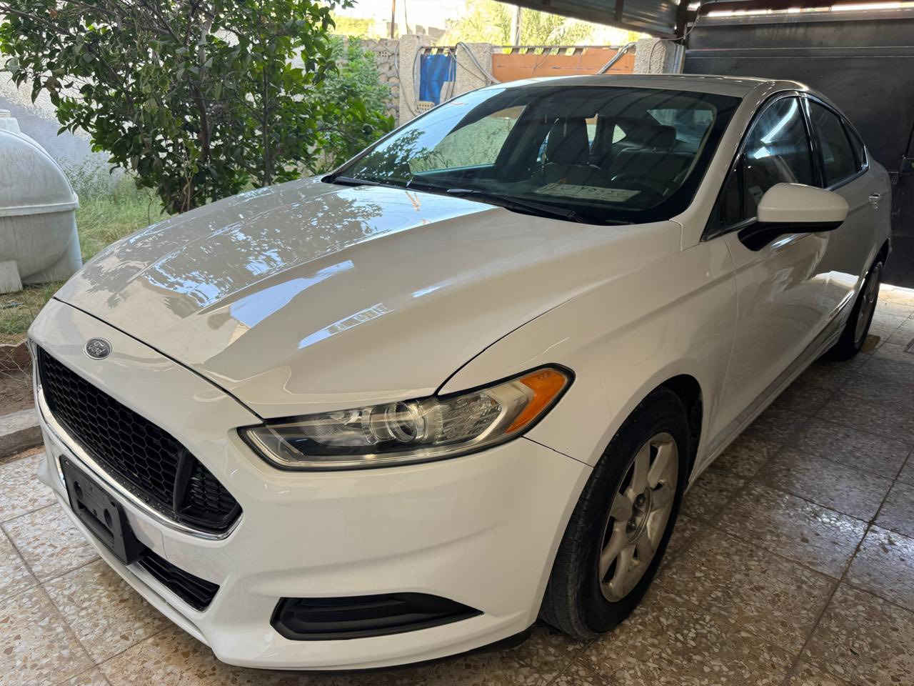 فورد فيوجن موديل 2013  محرك 2500 تنفس طبيعي اللون ابيض بغداد الصور المرفقة نظافة السيارة جيدة الحادث الأصلي دعامية جهة المعاكسة للسائق ومبدل الدعامية مع صبغ طرف البنيد وأجزاء اخرى نتيجة شخطات الشواصي واللغود سليمة السيارة موجدة ببغداد للتواصل (***********) اتصال فقط واتساب او رقم ، السعر 95 ورقة بيها مجال بسيط
