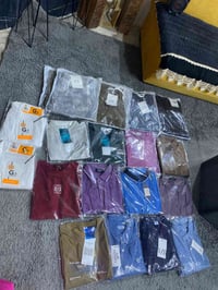 ٥٠ قطعة • ملابس متنوعة • بنطلون تيشيرت