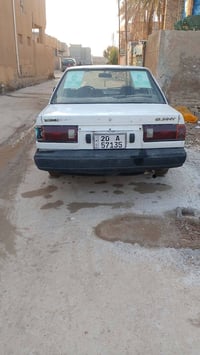 نيسان صني • ١٩٩٠ • تاجي