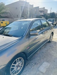 لانسر للبيع موديل 2005 امريكي أوتماتيك محرك وكير مكفول صدر يحتاجله ترت...