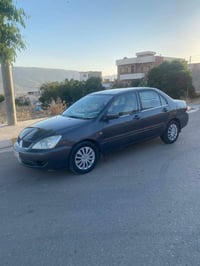 لانسەر مۆدیل ٢٠١١ گیر تۆماتیک  مواسەفات جوار جام کارەبای ئاوێنە کارەبا...