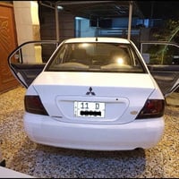لانسر رقم بغداد ب اسمي موديل 2011 كير اوتو AT محرك 1500 بي تنقيص بيها ...