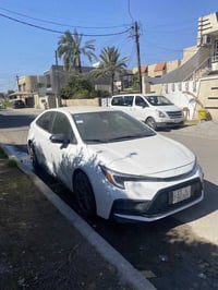 كورلا هايبرد موديل 2024 مرقمه بغداد باسمي وارد امريكي ماشيه 40 الف لون...