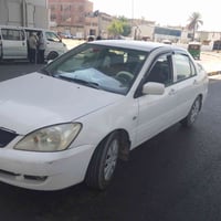 لانسر للبيع او مراوس رقم بغداد مديل 2007سنويه بسمي بيه تلاث قطع صبغ سع...